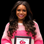 Jayla Hicks smiles while holding a Clinton High School award plaque. — Jayla Hicks earns All-District volleyball honors