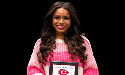 Jayla Hicks smiles while holding a Clinton High School award plaque. — Jayla Hicks earns All-District volleyball honors