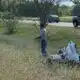 A Warren County Sheriff’s deputy injured in motorcycle crash, with responders and debris visible in the background.