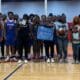 Warren Central High School basketball team and family memb — Warren Central honors the life and legacy of Henry Trisby III