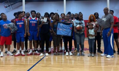 Warren Central High School basketball team and family memb — Warren Central honors the life and legacy of Henry Trisby III