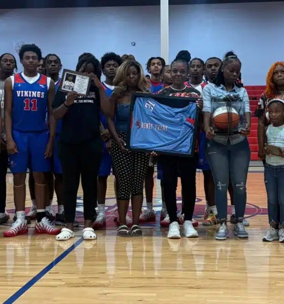 Warren Central High School basketball team and family memb — Warren Central honors the life and legacy of Henry Trisby III