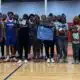 Warren Central High School basketball team and family memb — Warren Central honors the life and legacy of Henry Trisby III
