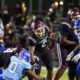 Hinds Community College football players in action during a game against Co-Lin, showcasing a tackle and team effo — 38-13