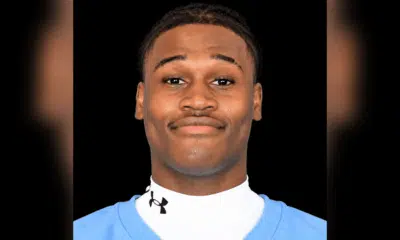 Royale Shelvy, a football player, smiles confidently in his team uniform.
