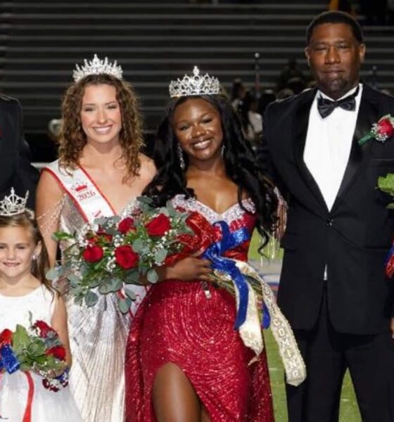 Rey’Nhila Gray crowned homecoming queen surrounded by family and court members on the football field.