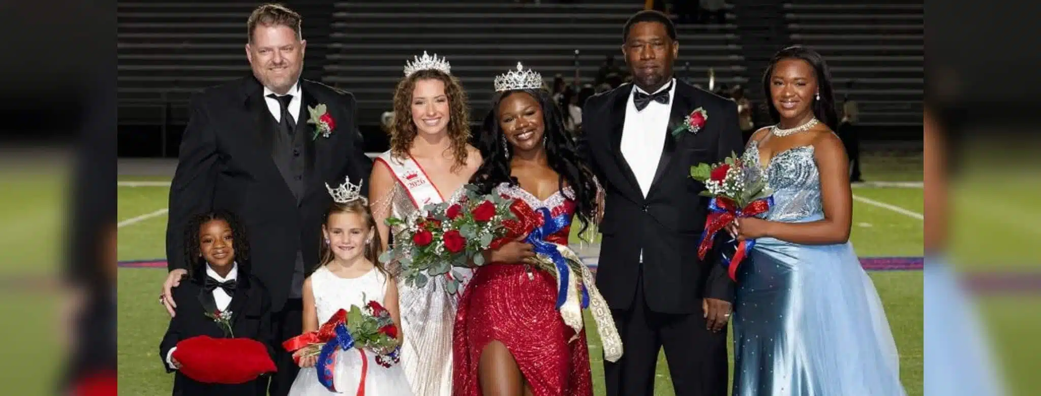 Rey’Nhila Gray crowned homecoming queen surrounded by family and court members on the football field.