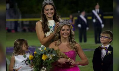 Hendrix Eldridge crowned homecoming queen wearing a pink dress and tiara, with a girl — Hendrix Eldridge Homecoming queen