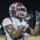 A Hinds Community College football player celebrating after a play during a game against Mississippi Delta, score 48-21.