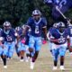 Port Gibson High School football team running onto the field, showcasing team spirit and en — Port Gibson Jefferson County