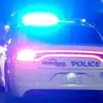 Vicksburg police car with flashing lights on a dark street Sunday night