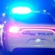 Vicksburg police car with flashing lights on a dark street Sunday night