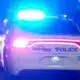 Vicksburg police car with flashing lights on a dark street Sunday night