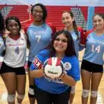 Warren Central volleyball seniors pose together with a volleyball on Senior Night, celebrating their achievements. — Swept
