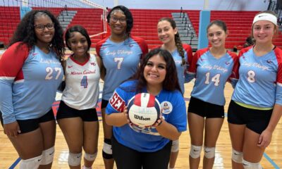 Warren Central volleyball seniors pose together with a volleyball on Senior Night, celebrating their achievements. — Swept