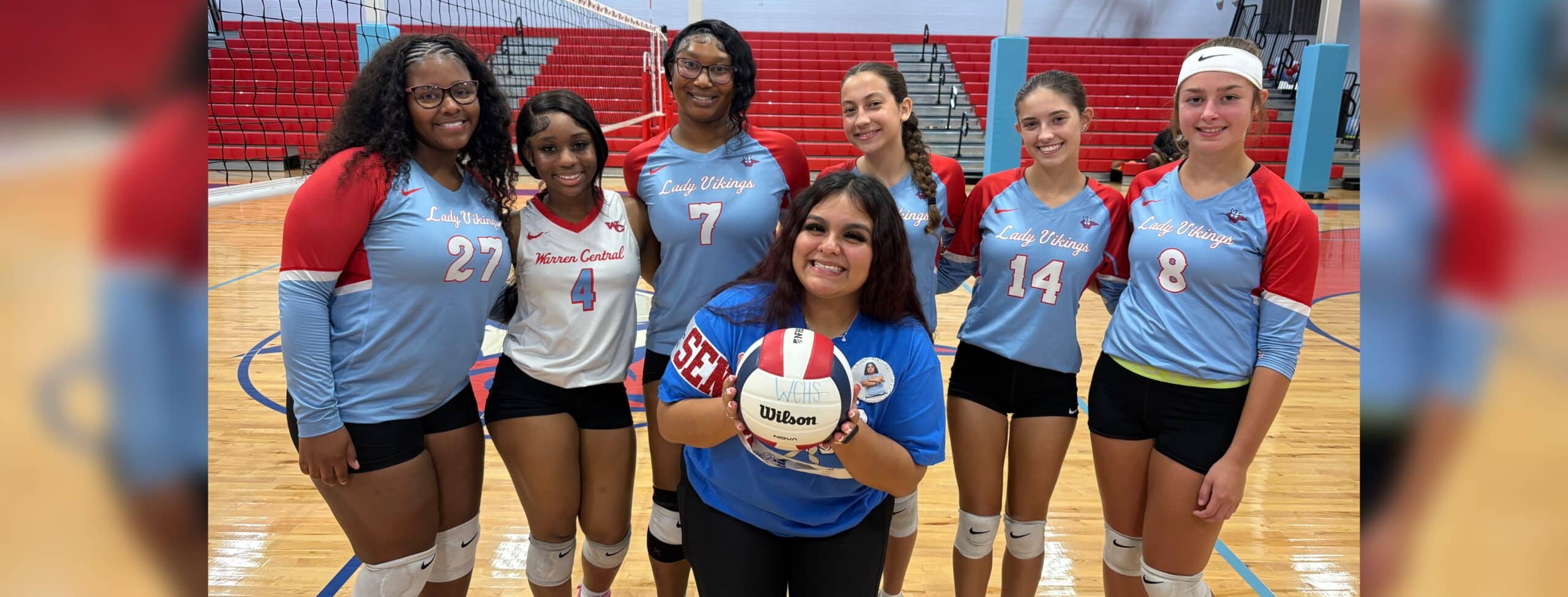 Warren Central volleyball seniors pose together with a volleyball on Senior Night, celebrating their achievements. — Swept