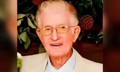 Portrait of Charles Byrden Landers wearing glasses and a light-colored suit jacket