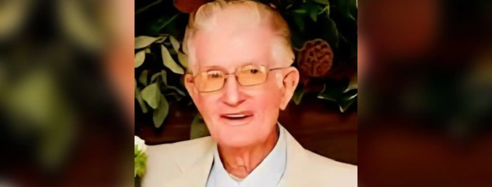 Portrait of Charles Byrden Landers wearing glasses and a light-colored suit jacket