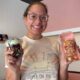 Punkies Dessert Lounge owner smiles while holding two — Punkies Dessert Lounge going mobile with addition of food trailer