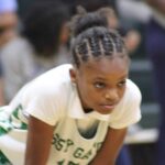 Genesis Phelps leads VJHS to a win over Pearl on Thursday as a Vicksburg player crouches on the basketball court.