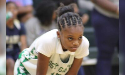 Genesis Phelps leads VJHS to a win over Pearl on Thursday as a Vicksburg player crouches on the basketball court.