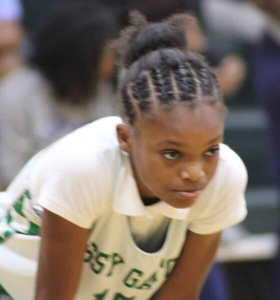 Genesis Phelps leads VJHS to a win over Pearl on Thursday as a Vicksburg player crouches on the basketball court.