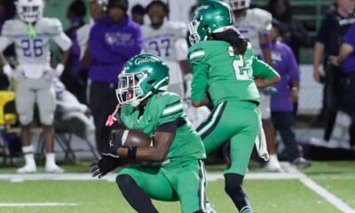 Gators 28-26 Cleveland Central: Vicksburg players in green uniforms celebrate on the field as opponents look on.