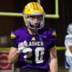 St. Aloysius Flashes football player in purple and gold uniform on the field as the Flashes clinch a pla — Flashes playoff
