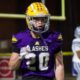 St. Aloysius Flashes football player in purple and gold uniform on the field as the Flashes clinch a pla — Flashes playoff